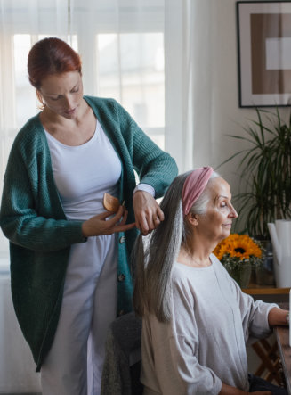woman helping senior